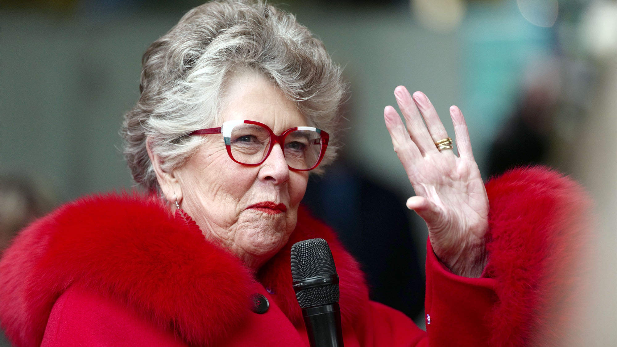 Prue Leith, the Great British Bake Off judge, waving to fans