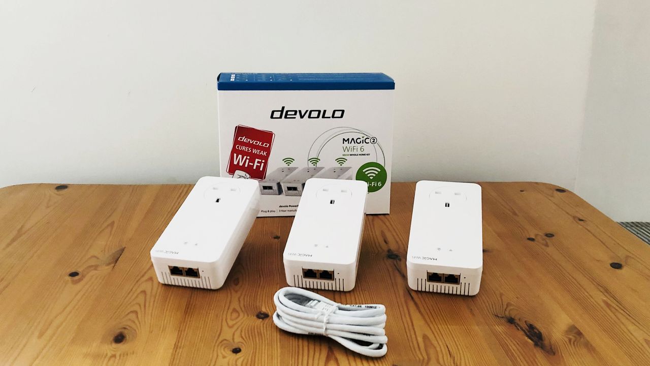 Devolo Magic 2 Wi-Fi 6 Mesh on a wooden desk