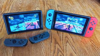 Two Switch consoles playing the same game of Mario Kart 8 Deluxe