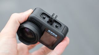 GoPro HERO13 Black action camera held in a hand