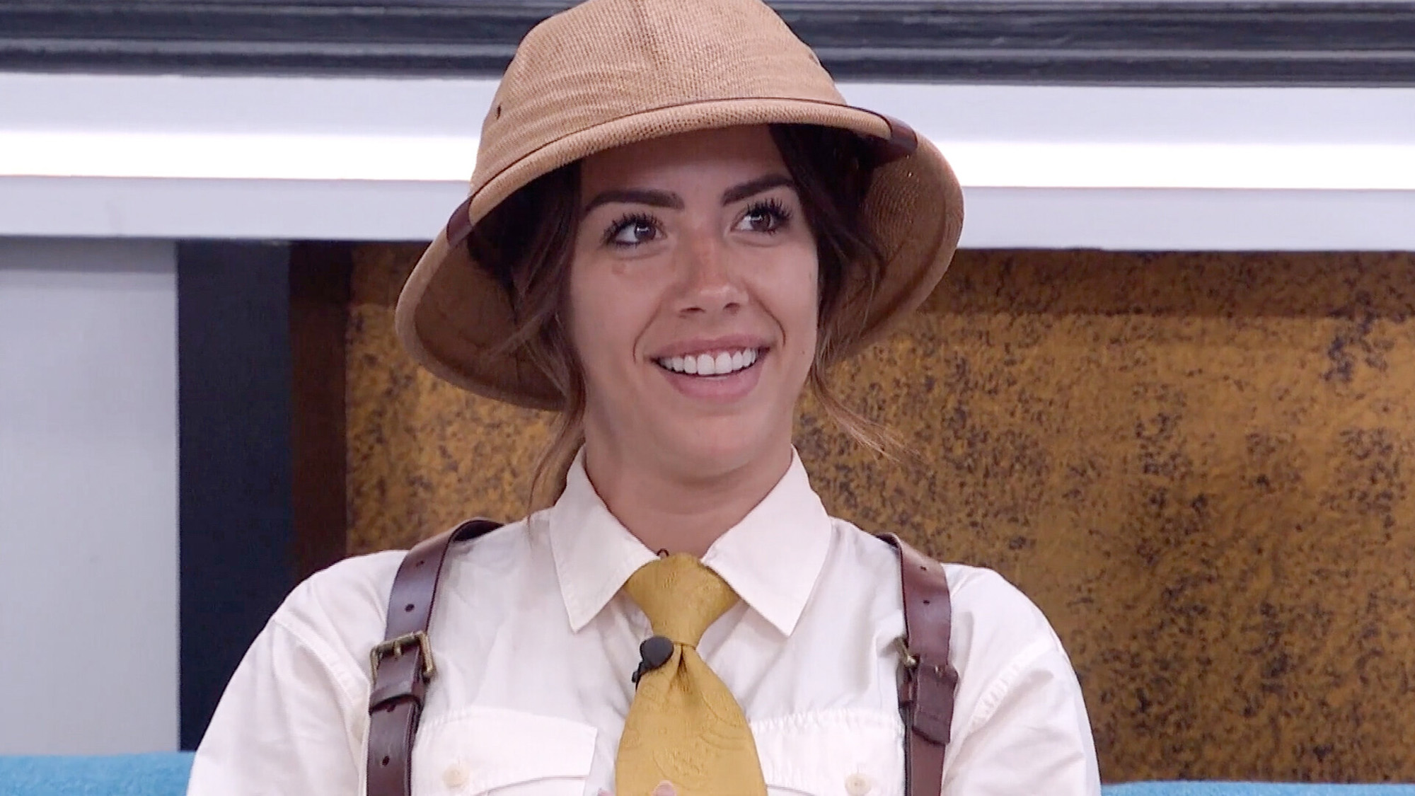 Dee in a straw hat, white shirt, suspenders and tie ready for a Big. Brother challenge in Season 28.