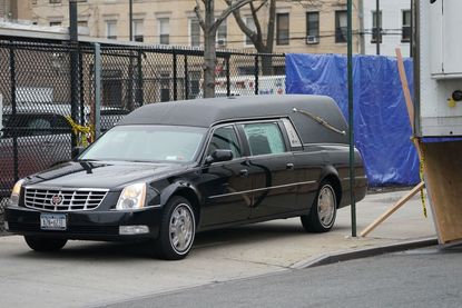 A hearse picks up a body at a New York hospital.