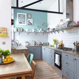 kitchen with grey cabinet and wooden flooring