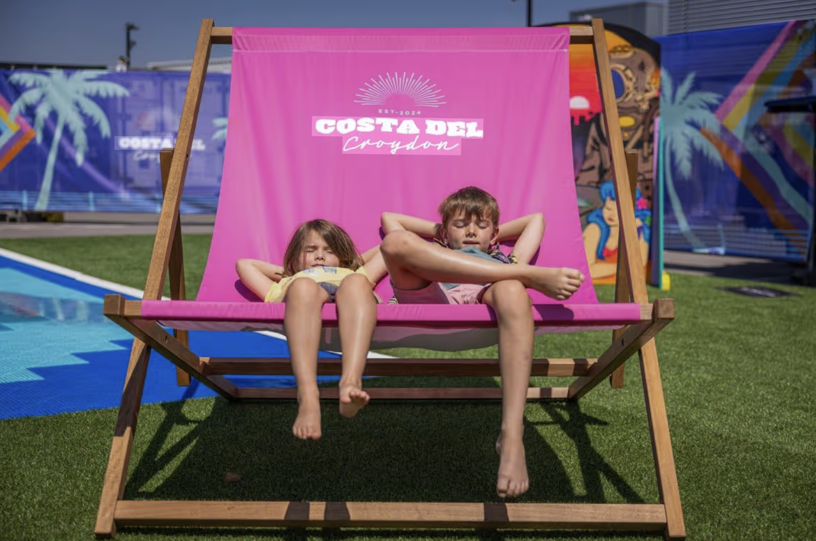 an image of the giant deck chair at Costa del Croydon with two kids lying in it