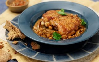 Chicken thighs and chickpeas in a bowl