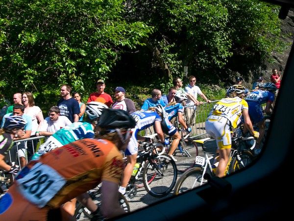 For the first time in the events history, the women's field caught and passed the men's field after just three laps into the race. Here's a photo from the media van as the women overtake the men's caravan on the Manayunk Wall. Afterwards, women from the Highroad team were heard joking "maybe they should train with us".