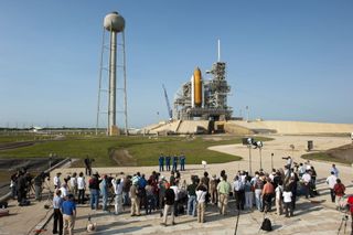 The STS-135 crew members speak to the media at NASA Kennedy Space Center's Launch Pad 39A in Florida.