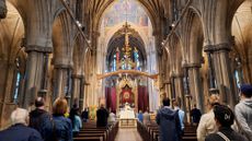 A congregation gathers in a church