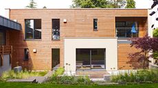 a modular home by baufritz with wood cladding and slimline windows - www.baufritz.uk