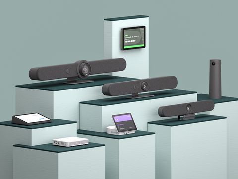 A range of video conferencing devices sold by Logitech neatly arranged on different sized platforms