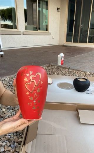 Red ceramic vase with raised surface decor