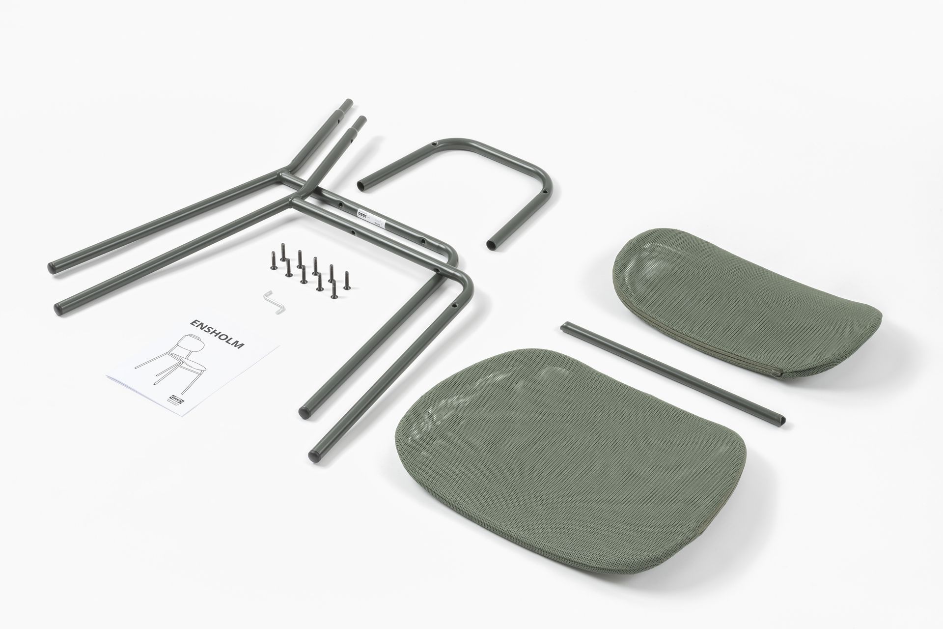 Parts of Ikea Ensolm chair and instructions laid out for assembly