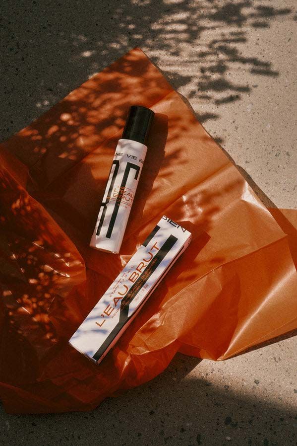 Narcyss skincare products in white packaging against orange background