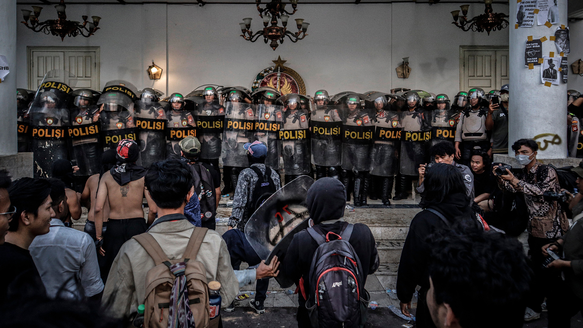 An angry crowd gathers in front of the People's Representative Council building in Yogyakarta, Indonesia, to demand government action on natural disasters and the cost of education and healthcare