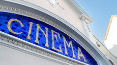 Mosaic cinema sign in tiles on local picture house