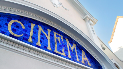 Mosaic cinema sign in tiles on local picture house