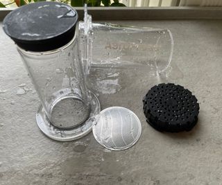 AeroPress coffee maker in parts, having been washed up