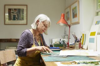 Woman making greeting cards from home