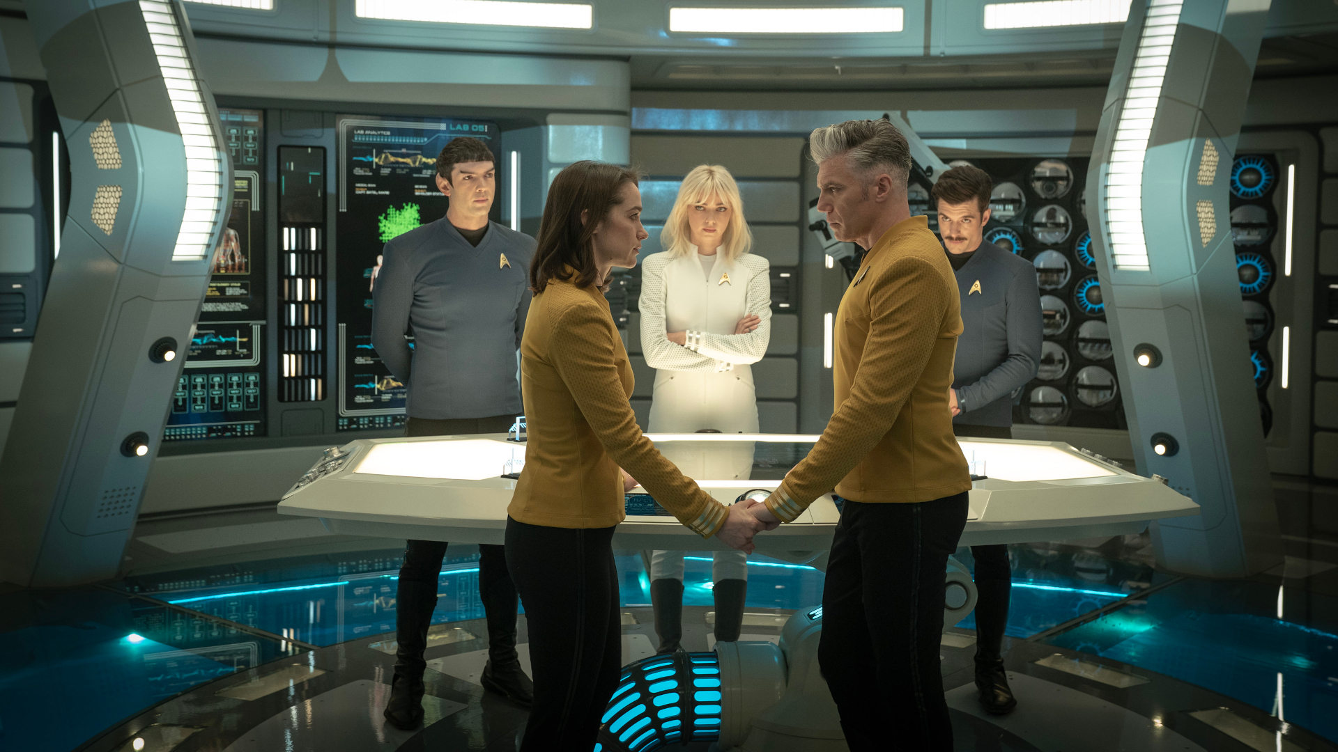 Ethan Peck as Spock, Melanie Scrofano as Batel, Jess Bush as Chapel, Anson Mount as Capt. Pike and Dan Jeanotte as Sam Kirk in season 3, Episode 10 of Strange New Worlds streaming on Paramount+. Photo Credit: Marni Grossman/Paramount+