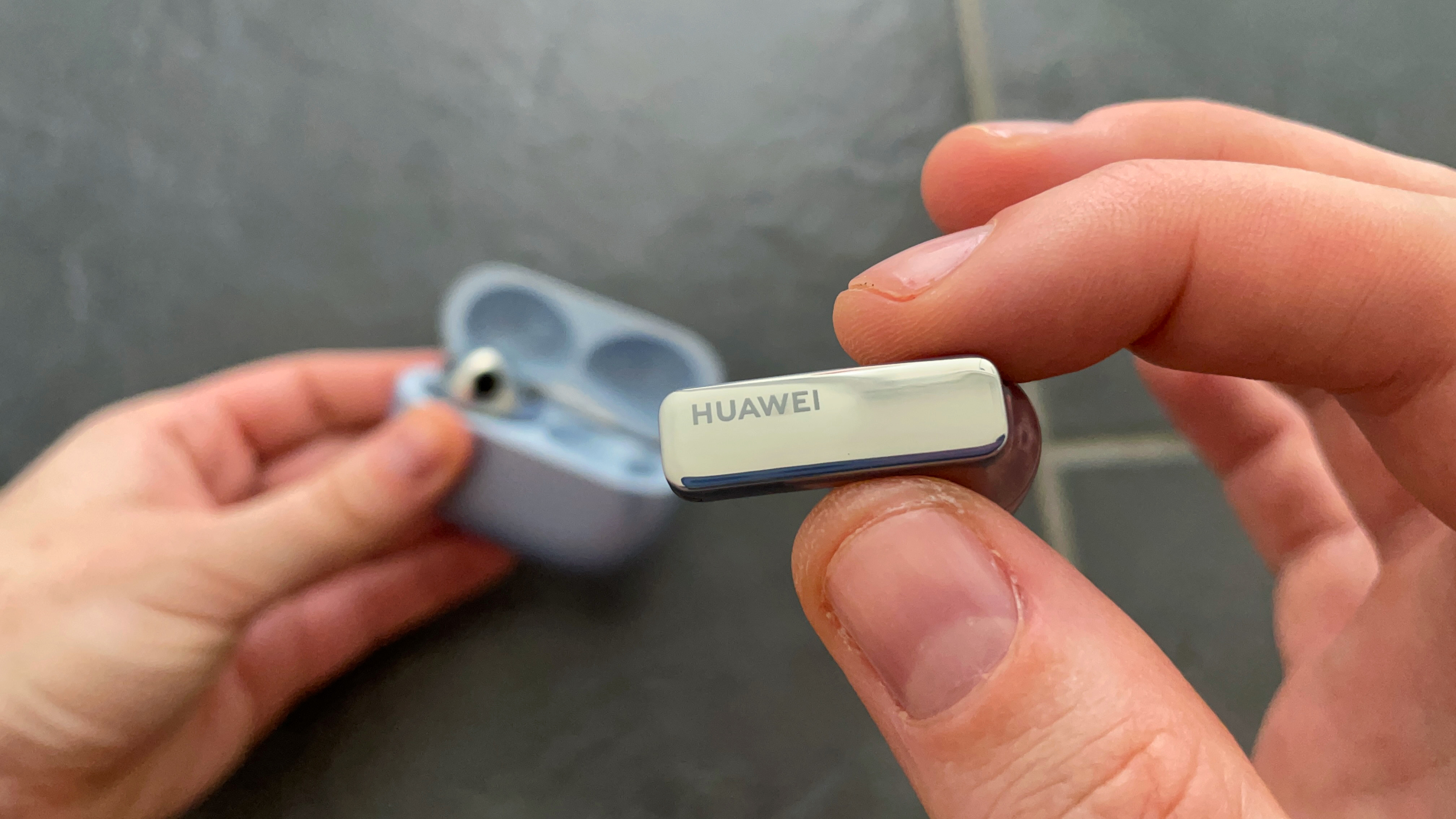 Huawei Freebuds Pro 2 bud held in hand to show the branding on the stem