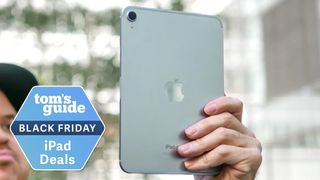 iPad Mini being held up with Black Friday badge