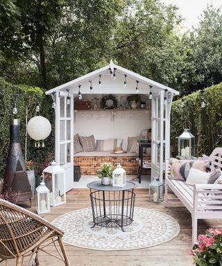 garden shed with cushion and white bench
