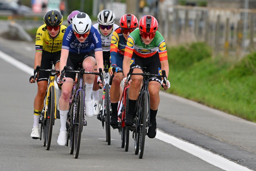 WAREGEM BELGIUM MARCH 27 LR Marianne Vos of The Netherlands and Team VismaLease a Bike Puck Pieterse of The Netherlands and Team FenixDeceuninck Lotte Kopecky of Belgium Shirin van Anrooij of The Netherlands and Elisa Longo Borghini of Italy and Team Lidl Trek compete in the breakaway during the 12nd Dwars door Vlaanderen 2024 Womens Elite a 1299km one day race from Waregem to Waregem on March 27 2024 in Waregem Belgium Photo by Luc ClaessenGetty Images