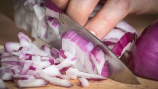 Red onions getting sliced. 