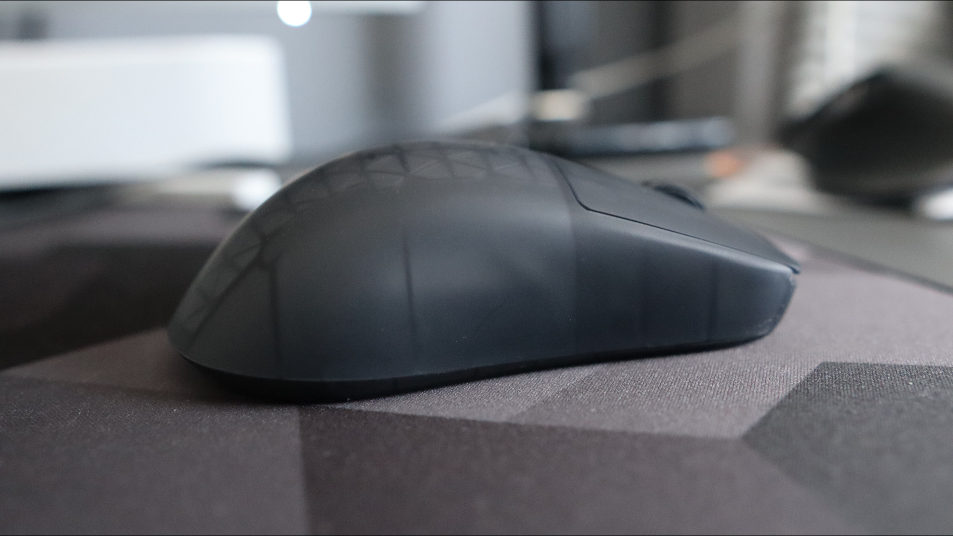 An Endgame Gear OP1w 4K gaming mouse on a desk.