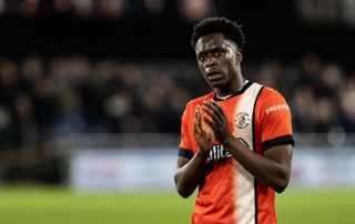 Luton Town's Albert Sambi Lokonga applauds his side's supporters after a draw at home to Everton in May 2024.