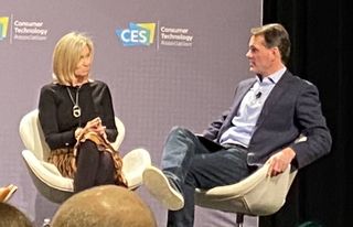 A+E strategy exec Amy Baker speaks with Rob Aitken, managing director for Monitor Deloitte, at CES Tuesday.