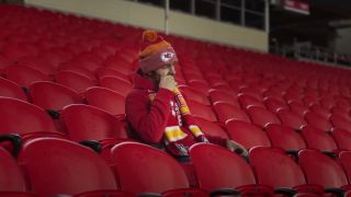 Tyler Hynes sits in Arrowhead Stadium in the Chiefs' 2024 postseason commercial "Falling for Football."