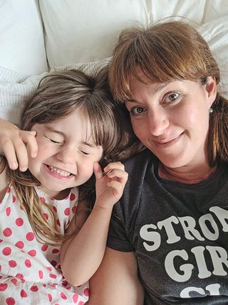 mother and daughter smiling