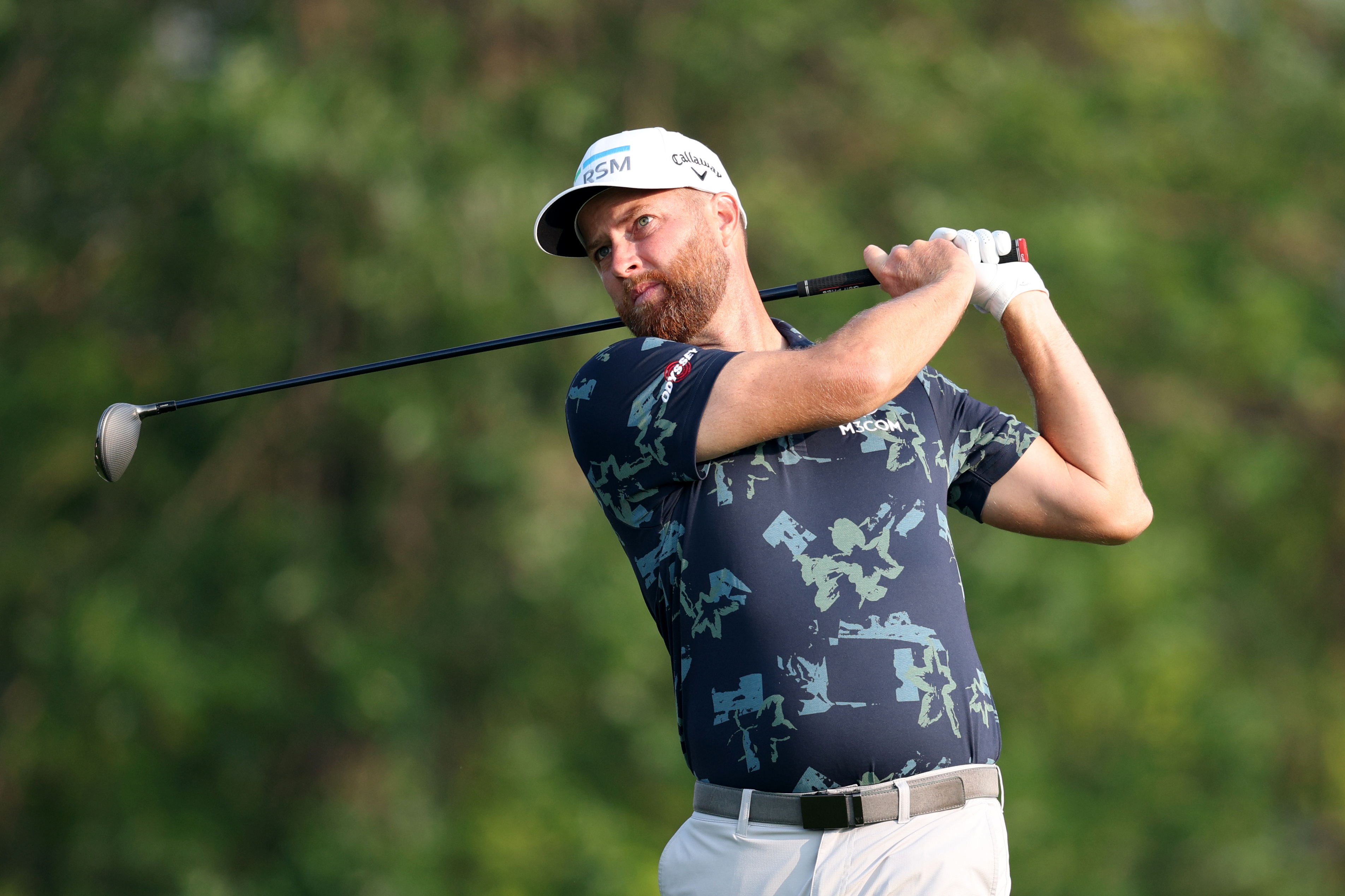 Chris Kirk hits a fairway wood