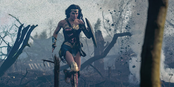 Wonder Woman charging through World War I battlefield