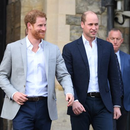 Prince Harry and Prince William, Duke of Cambridge embark on a walkabout ahead of the royal wedding of Prince Harry and Meghan Markle on May 18, 2018 in Windsor, England