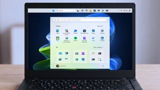 Lenovo ThinkPad laptop with Windows 11 using a top-mounted Taskbar