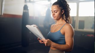 A woman looking at her training plan