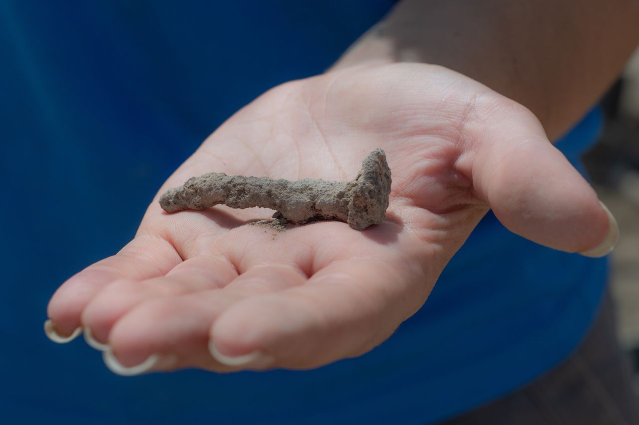 The nail that secured the jar to the floor when it was buried.