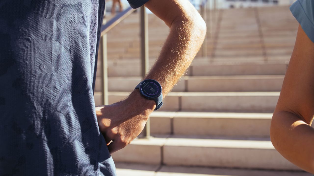 Polar Pacer Pro worn by an athlete in a stadium