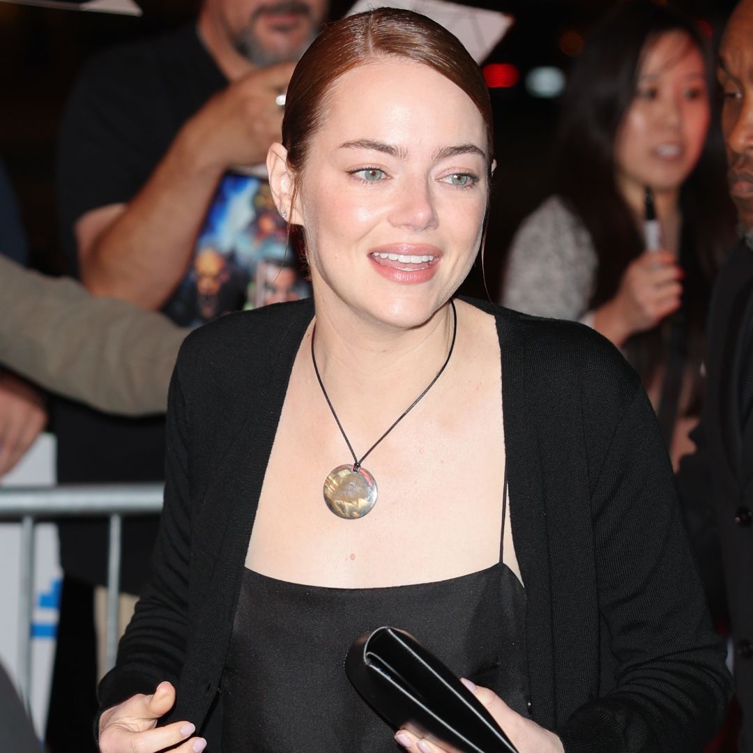 Emma Stone accessorized her all-black satin set with the cord necklace trend