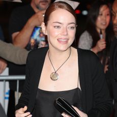 Emma Stone accessorized her all-black satin set with the cord necklace trend