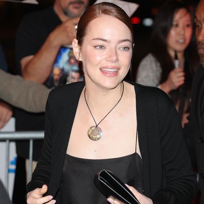 Emma Stone accessorized her all-black satin set with the cord necklace trend