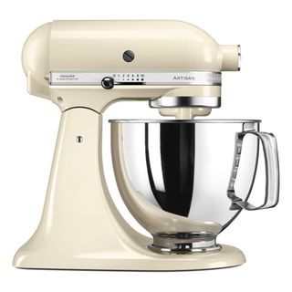 cream stand mixer with silver mixing bowl