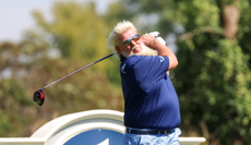 John Daly hits a tee shot with a driver