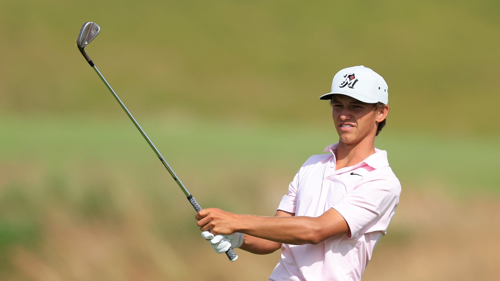 Miles Russell hits a wedge shot