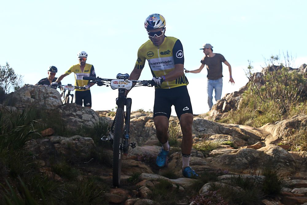 Henrique Avancini and Manuel Fumic of Cannondale Factory Racing move through the portage at the Gantouw Pass during stage 5 of the 2019 Absa Cape Epic