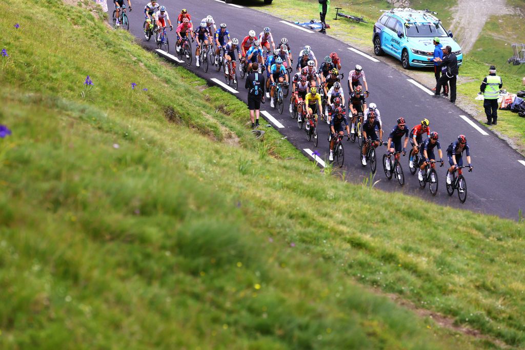 LUZ ARDIDEN FRANCE JULY 15 Dylan Van Baarle of The Netherlands and Team INEOS Grenadiers Tadej Pogaar of Slovenia and UAETeam Emirates Yellow Leader Jersey Jonas Vingegaard of Denmark and Team JumboVisma White Best Young Rider Jersey Wout Poels of The Netherlands and Team Bahrain Victorious Polka Dot Mountain Jersey The Peloton at Col du Tourmalet 2115m during the 108th Tour de France 2021 Stage 18 a 1297km stage from Pau to Luz Ardiden 1715m Fans Public LeTour TDF2021 on July 15 2021 in Luz Ardiden France Photo by Tim de WaeleGetty Images