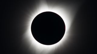 the sun's outer atmosphere is visible around the moon during a total solar eclipse in august 2017