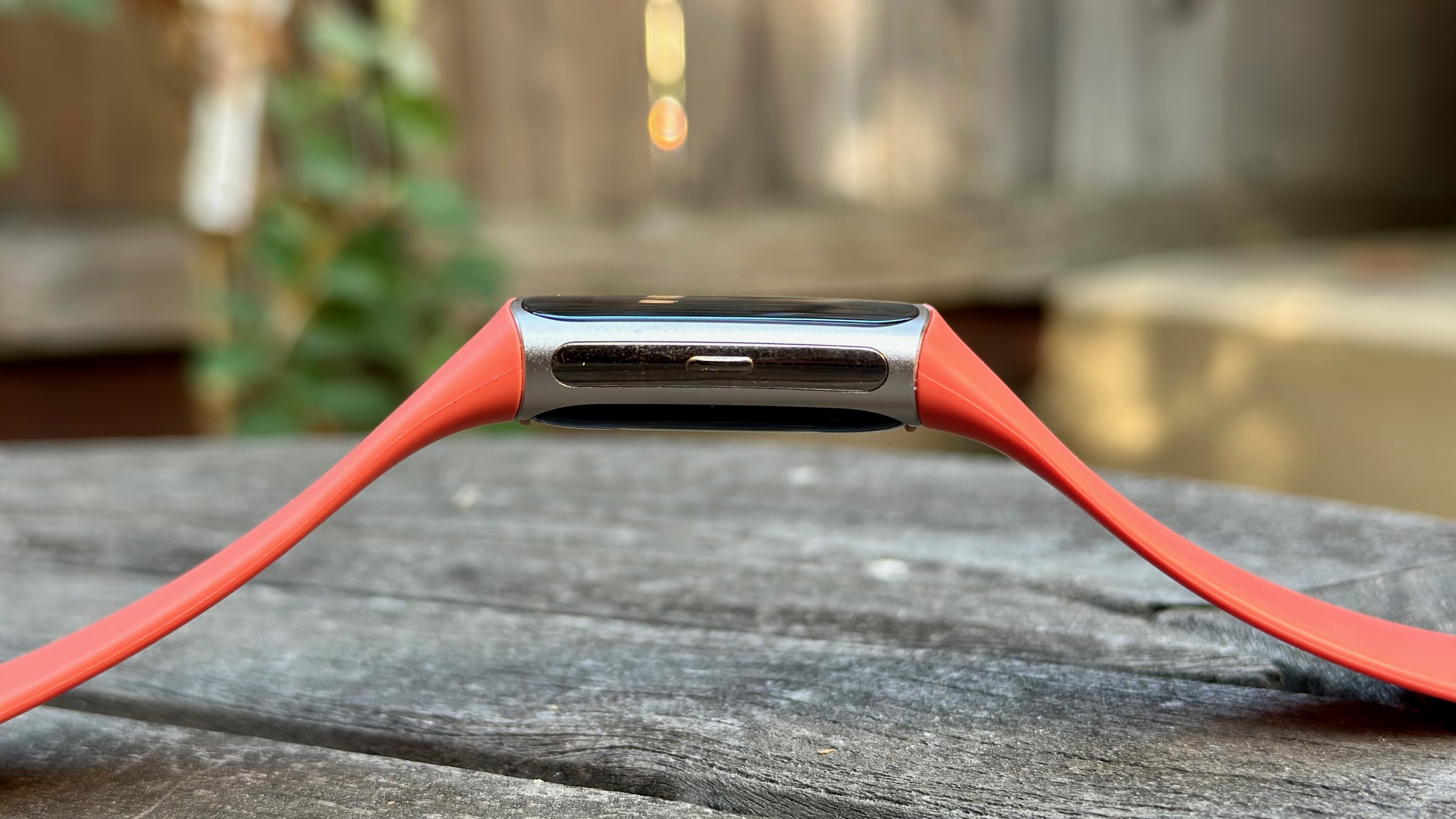 Side view of the Fitbit Charge 6, focused on the haptic button.